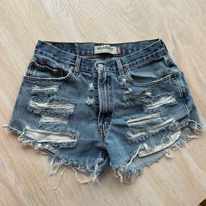 Distressed, relaxed fit Levi’s cut off shorts